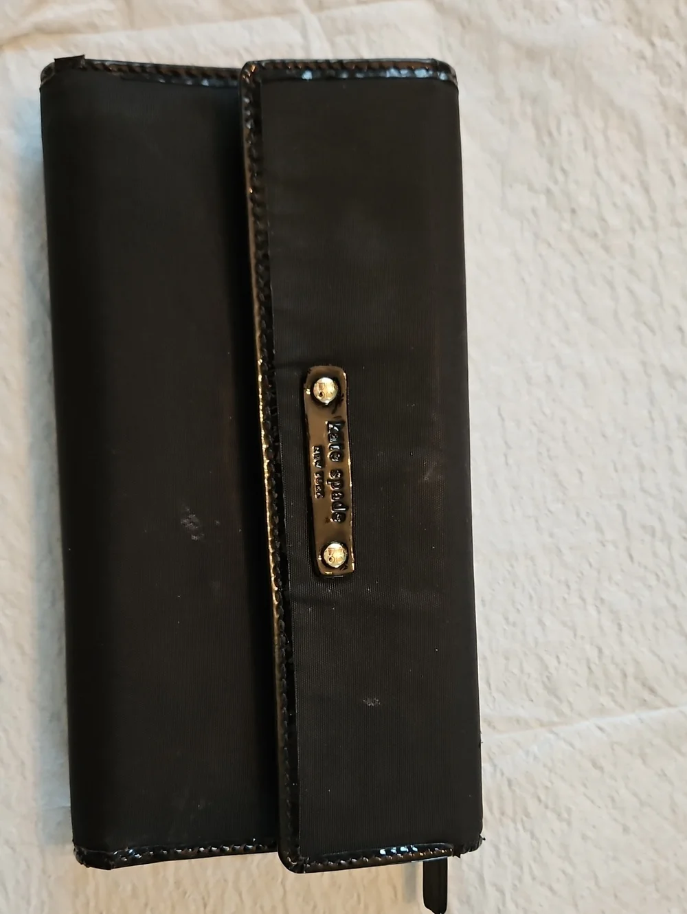 kate spade black wallet with gold-tone nameplate